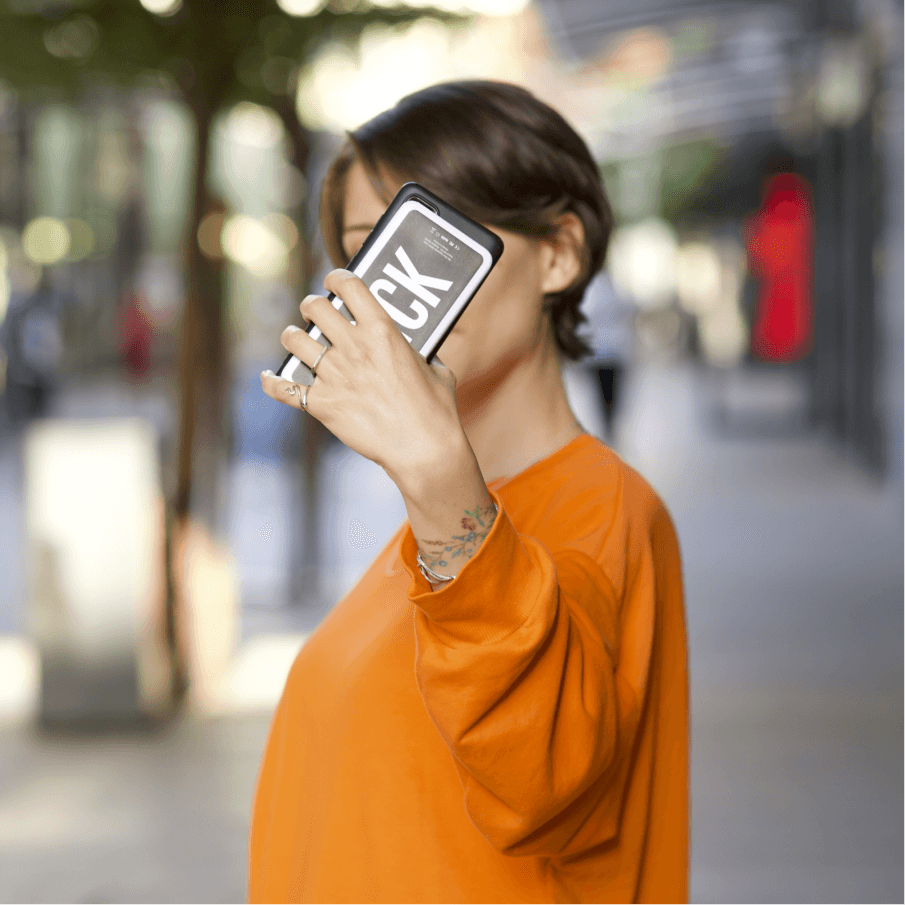 A woman holding up a Brick powerbank